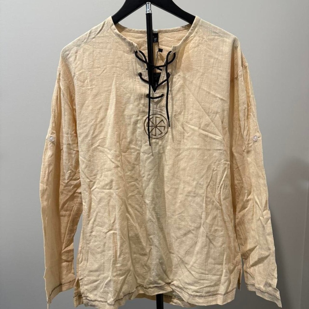 Cream long sleeve‎ shirt with lace up front and buttoned sleeves. Size: XL